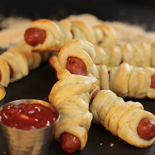 Mummified pigs in a blanket are the yummiest Halloween snack. Full Recipe: taste.md/2yTv4IE | Tastemade
