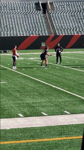 QB Sean Clifford works with center Jacob Bayer on Tuesday at practice inside Paycor