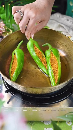 67K views · 546 reactions | If you’re seeking a flavorful vegetarian dish that’s both vibrant and true to its roots, look no further than Bharela Marcha (Stuffed Green Peppers): Authentic Gujarati Recipe. This beloved classic from Gujarat stands out as a no onion, no garlic preparation, making it perfect for festive occasions and traditional meals. . Comment “ Marcha “ I’ll send full recipe in your inbox! . . . . | Binjal's VEG Kitchen | Facebook