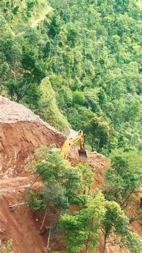 Komatsu Excavator Digging Mountain Road