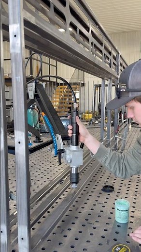 The Flex Arm by ‪@FlexMachineTools‬ making light work of tapping these holes for this glass railing!