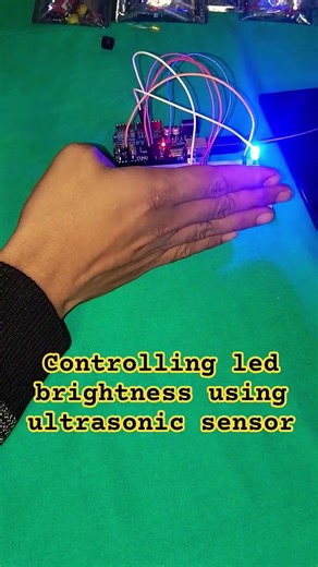 controlling led brightness using ultrasonic sensor #robotics #arduino #shortsfeed #viral #trending