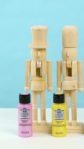 Easy DIY Shimmering Painted Nutcrackers - Add some shimmer to the holiday season with FolkArt Color Shift Metallic Acrylic Paint. See the colors in this beautiful paint line shift in changing light for an eye-catching appearance. Give your holiday decorations a glistening finish with this paint available at https://plaidonline.com/brands/folkart/color-shift ✨ #PlaidCrafts #nutcracker #ChristmasCrafts | Plaid Crafts