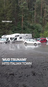 40K views · 151 reactions | The Merdovine river burst its banks in an explosion of mud, breaking through a bridge wall, uprooting a tree and flooding the streets of Bardonecchia, Italy on August 13. Over a hundred people have been displaced, with the Alpine town covered in thick mud. | TRT World | Facebook