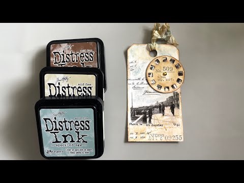 Mixed media art tag using collage, and distress inks.