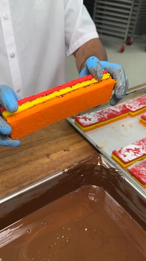Rainbow cookies 🌈 🍪 Classic tri-colored layers of cake cookie brushed with rum, layered with raspberry puree, and covered in chocolate! A rich and delicious bestseller! #RainbowCookies #Bakery #LasVegas #Cookies | Freed's Bakery