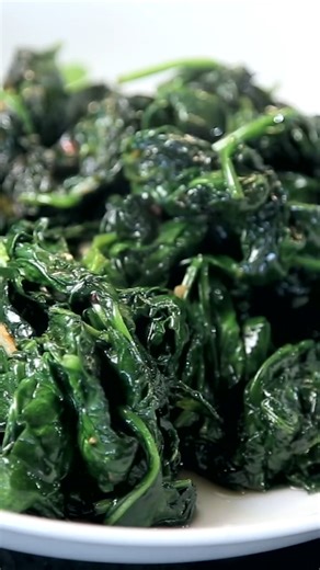 Learn how to cook spinach in only 10 minutes! This easy sautéed spinach side dish recipe is seasoned simply with olive oil and garlic. Recipe 👉 https://www.healthyseasonalrecipes.com/easy-sauteed-spinach-with-garlic/ | Healthy Seasonal Recipes