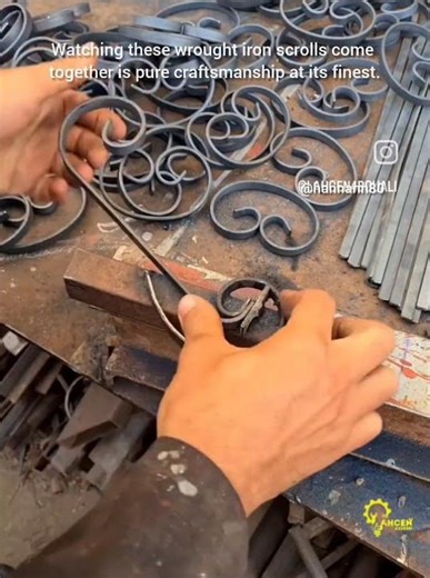 Mass-producing scrolls for a custom gate design.precision in this metal bending is mesmerizing #like