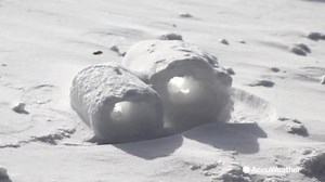 What are snow rollers and how do they form?
