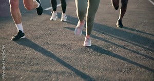 People, legs and running on road in exercise, outdoor fitness or cardio training on asphalt. Closeup of active or athlete group of runners feet in sprint, race or practice on street for lose weight