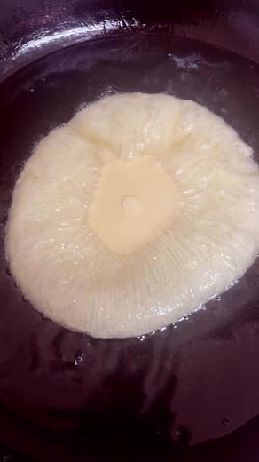 Frying Dough in Hot Oil: Cooking Process Revealed