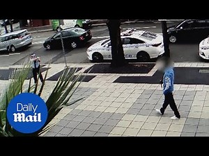 Police use a taser on a man who pulled a knife outside station