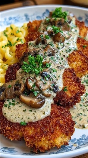 Crispy Chicken Schnitzel with Creamy Mushroom Sauce Golden and perfectly crunchy on the outside, juicy and tender on the inside — this Crispy Chicken Schnitzel with Creamy Mushroom Sauce is pure comfort food. The rich, velvety mushroom sauce takes it to the next level! 🧾 Ingredients For the Chicken Schnitzel: 2 large chicken breasts, halved horizontally Salt & black pepper, to taste 1 cup all-purpose flour | The Cozy Spoon