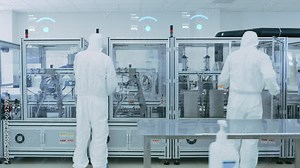 Manufacturing Facility Workers Assembling Products Using Industrial High Precision Machinery. Special Effects Animation: Wi-Fi Connected Icons with Completion Progress