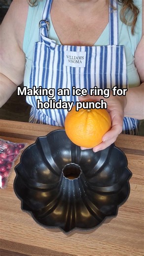 Grandma's holiday punch is perfect when you add an ice ring. Made in a Bundt or fluted cake pan. Simply add layers of orange slices, fresh cranberries and other citrus. Add it in layers with a little bit of water. Freezing in between adding layers. #holidayrecipes #holidayseason #easyrecipes #homemade | A Farmgirl's Kitchen