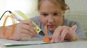 Creative girl using 3d pen printing 3D shape. 4k