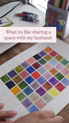 Krishna Kayastha | Artist, Writer, Forever Learner on Instagram: "*sound on* He works from home and sometimes the internet doesn't work, the computer is slow, the company program is updating, or a good deal has expired 🤣🤷🏾‍♀️ Sharing creative spaces with spouses isn't for the weak. I do dream of a space of my own but I know id just drag him in there with me bc id miss him 🥰🙈 Epic tape pull ASMR on this watercolor grid. Lol #atlantaartist #watercolorpainting #tapepull"