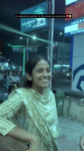 Sahana on Instagram: "So this happened... I was just humming to myself at the shawarma kadai when the akka there complimented me... Next thing I know, this kyootie @_ulavan_magan_ (white t shirt at my back) is acting like my PR manager, making her follow my page and watch my videos while we ate! 😂❤️ ​Even with a heavy cold, I had to give a 'live performance' so she’d believe that raspy voice was actually mine.. Hoping for those 'singer discounts' next time! 🏃🏻‍♀️🏃🏻‍♀️ @arrahman @singer_mano