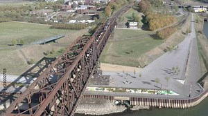 Freight Train Transporting Goods Across a Bridge For Logistics and Industry