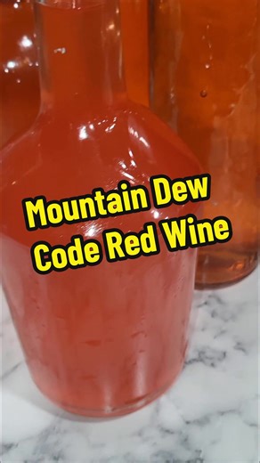 Mountain Dew Code Red wine along with some juices to wine that I bottled recently. These aged about 6 months before I bottled them. #homemadewine #wine #winemaker #mountaindew #codered #winetiktok🍷 #housewifehacks #winemaking #easytomake #winetime