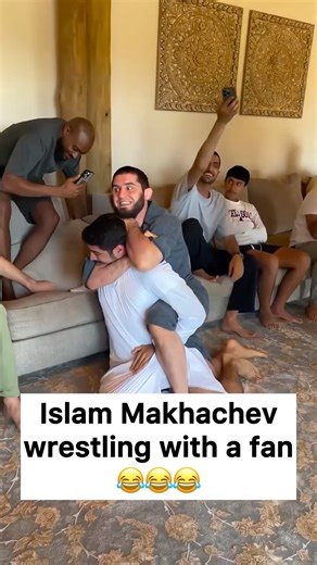Islam Makhachev wrestling with a fan 😂