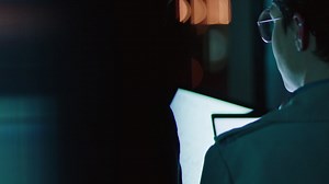 Business team working late colleagues using tablet computer brainstorming ideas for project deadline manager woman sharing strategy meeting in office at night | Premium Stock Video Footage