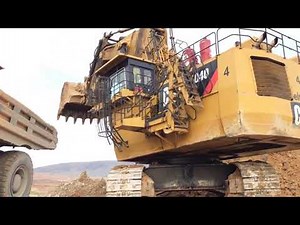 Caterpillar 6040 Excavator Loading Hitachi EH3500 Dumpers And Operator View