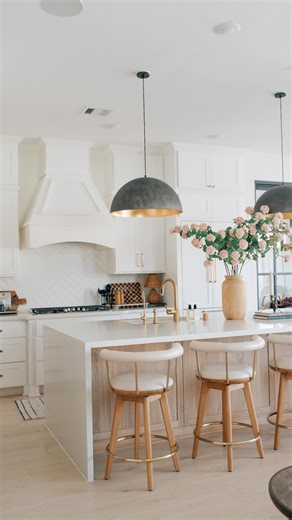 Welcome to our kitchen! The room that we spend the most time in. We recently upgraded our counter stools to these beautiful ones from @denvermodern. This is the Keystone Swivel Stools in pearl leather and they fit so well in our home. The Italian leather is comfortable and the gold detailing with the wood ties it all together. Plus! It swivels so my kids can easily get in and out. #kitchendesignideas #transitionalstyle #ltkhome | The Annie Issue-fashion and lifestyle blog