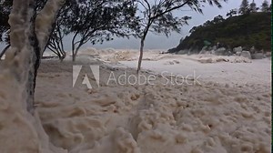 Cyclone Alfred 2025 - Sea Foam Blown Onto A Beach During Severe Tropical Cyclone Alfred. - closeup shot