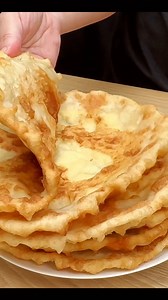 320K views · 2.2K reactions | Ingredients: 700 gr flour 500 ml kefir 1 teaspoon salt 1 tablespoon sugar 1 teaspoon baking soda For the filling 700 gr cottage cheese 3 eggs Salt Oil for frying | Rhapsody Food | Facebook