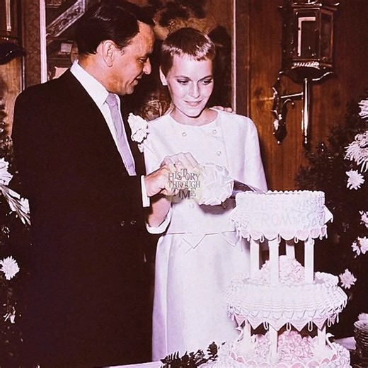 "Frank Sinatra and his third wife, Mia Farrow, are photographed on their wedding day in Las Vegas, July 19, 1966. The ceremony took place at the Sands Hotel, a famed Rat Pack haunt, where Sinatra’s close friend Jack Entratter served as best man. At just 21 years old, Farrow was 30 years Sinatra’s junior, making headlines as the youngest woman ever to marry the iconic crooner. Their brief, high-profile union—amid the glare of Hollywood and political press—reflected the turbulence of the 1960s, la