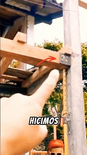 How to join a wooden beam to a reinforced concrete column. Metal plate and bolts. Composite struc...