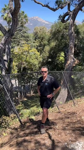 CLEARVIEW LANDSCAPING on Instagram: "Keep the coyotes in the foothills and your pets safe in the yard. Check out this custom "coyote fence" we just wrapped up in San Roque. To keep predators out, height isn't always enough—it’s about the angle. We installed this 6-foot black mesh chain link with a specific downward slope. When you’re building on a grade like these Santa Barbara foothills, that angle creates a massive vertical challenge (nearly 10 feet!) that stops coyotes—and even most deer—righ