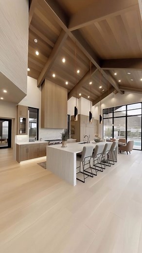 51K views · 745 reactions | From a soaring great room that opens to the terrace and pool, to a vaulted kitchen wrapped in oak, stone, and soft light, every line is drawn to frame calm. Private suites rise under timbered ceilings, spa baths settle into marble and brass, and lifestyle rooms, home theater, custom wine room, and a sunlit study carry the rhythm of gathering and retreat. Designed by @m.hstudi0 | Interior Design | Facebook