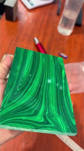 This video shows synthetic malachite polished plates used for lapidary work, jewelry making, inlay