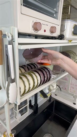 Water draining and storage shelf. Holds pots, bowls, plates. Saves space. Who doesn't like it?