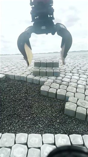 Operator Mastery Installing Large Concrete Pavers with an Excavator