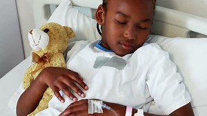 Sick girl resting with teddy bear on bed Free Stock Video Footage