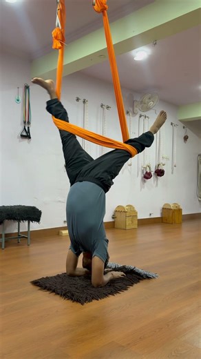 Scorpion pose with the help of hammock.