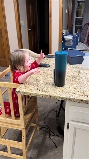 Greg caught Cora “recording” herself!! This is exactly what I do at the island. I rest my phone against my water bottle and hit record. She put her play phone against my water bottle and started hosting her own pod cast! She’s the best! #shadow #quick #toddlersoftiktok #theluckyfew #corajill