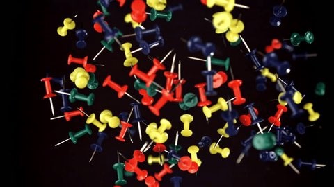 clip-3996876745-multi-colored-paper-clips-fly-fall-down-filmed