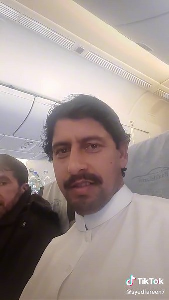 Airplane Dining Experience: Passengers Enjoy Meals