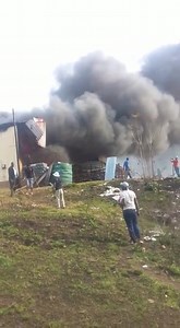 Water tanks scattered all over as Hlathikhulu Buy Cash Hardware burns. | Swaziland News