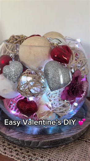Simple Valentine centerpiece made with just a few pieces. Easy to style, easy to reuse, and perfect for adding a festive pop of color anywhere in your home. 💕 #valentinesdiy #seasonalgems #homedecorideas #hearts #centerpieces