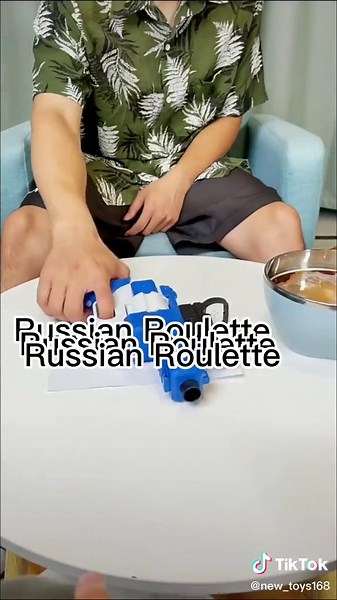 Kid Playing Russian Roulette Toy Gun Game