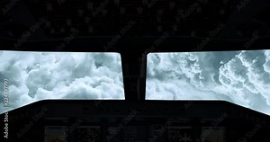 An airplane cockpit view flying straight through the clouds while turning right and then back to centre.