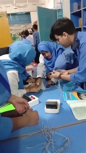 Students engaged in Physics lab work.#Physics #SchoolActivity SUN RISE MODEL SCHOOL