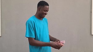 nigerian excitedly counting the new naira notes