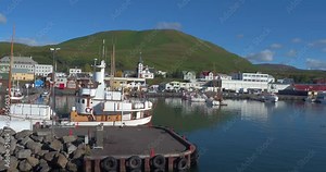HUSAVÍK, ICELAND – SEPTEMBER 2016 : Aerial shot of Husavík Bay on a beautiful day with boats and ships in view