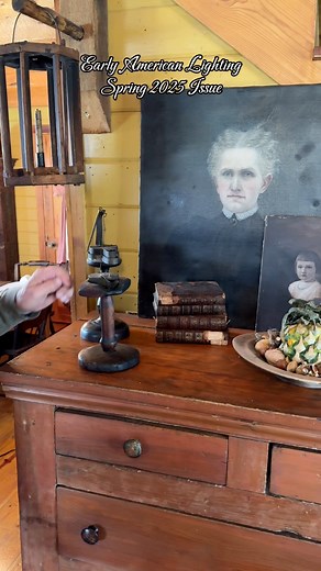 Did you know? Betty lamps, used in early America, were an improvement over earlier grease lamps and rushlights. They featured a covered reservoir to hold animal fat or fish oil, with a wick emerging from a spout. This design reduced smoke and improved efficiency. The name “Betty” may have originated from the German word besser (meaning “better”), highlighting their advantage over open saucer-style lamps. These lamps were commonly used in colonial homes and even by Shakers, who appreciated their